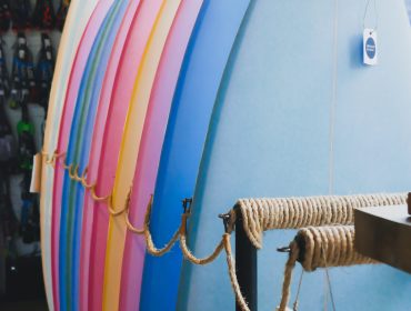 close-up-multi-colored-surfboards-hanging-row (1)